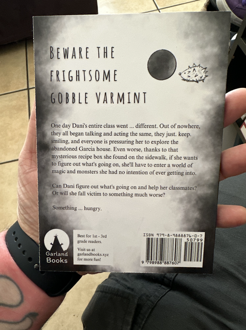 The back cover of the paperback version of the chapter book Invasion of the Gobble Varmint by C. Garland Miller.